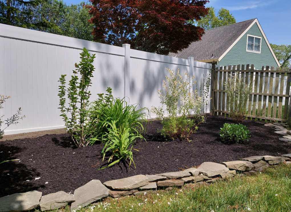 Black mulch landscaping for beauty and flower bed protection